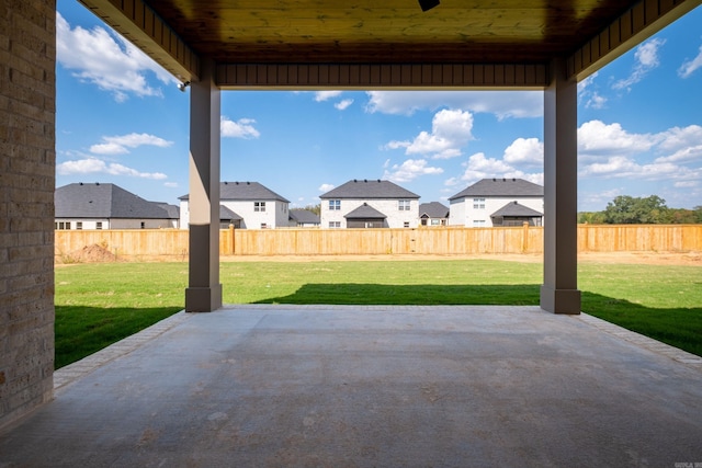 view of patio featuring a residential view and a fenced backyard