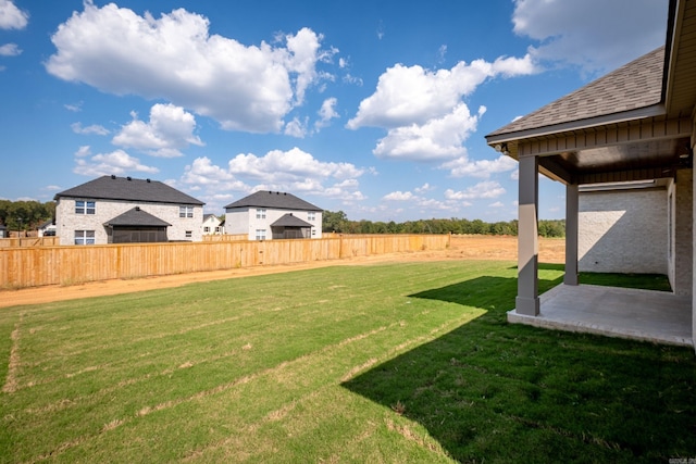 view of yard featuring a patio area and a fenced backyard