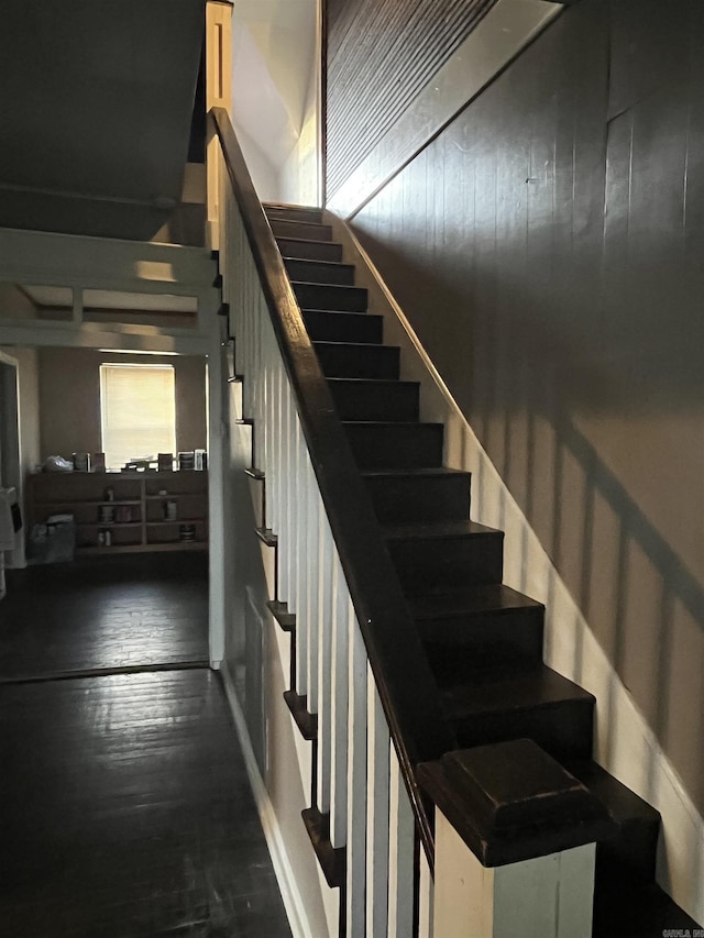 stairs with wood finished floors