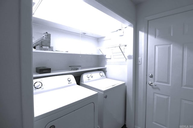 laundry area with washing machine and dryer