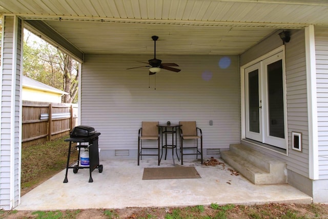 view of patio / terrace featuring entry steps, fence, and grilling area