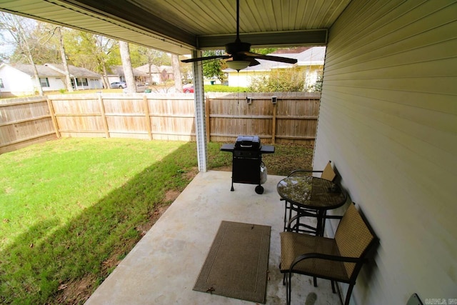 view of patio / terrace with a ceiling fan, a fenced backyard, and grilling area