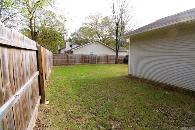 view of yard with a fenced backyard