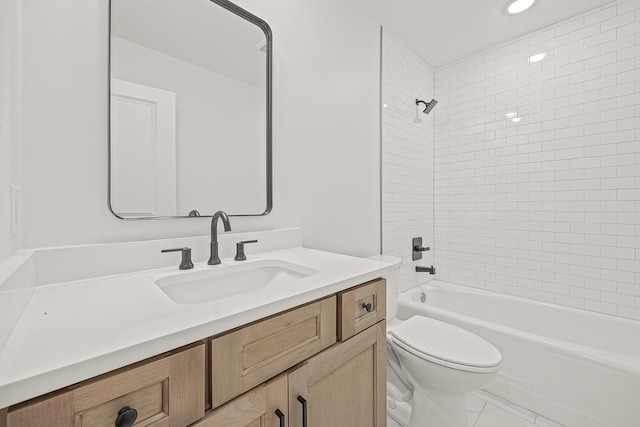 bathroom with tub / shower combination, vanity, and toilet