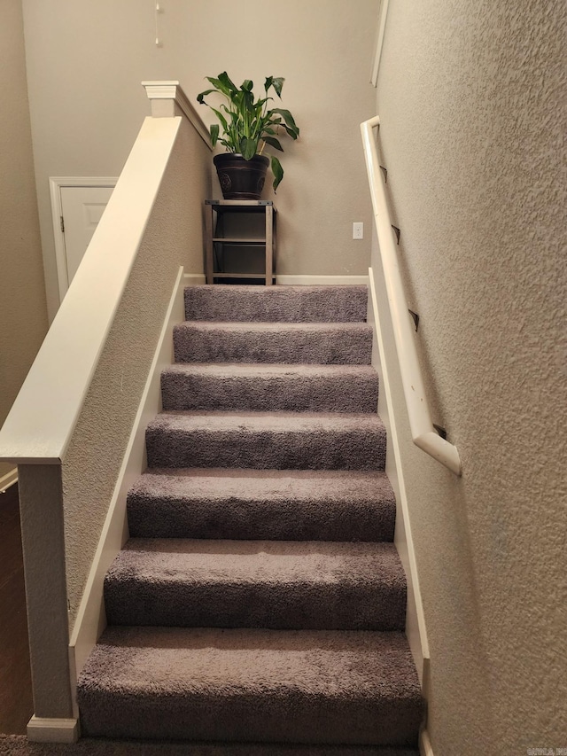 stairway with baseboards