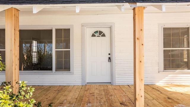 doorway to property with a wooden deck