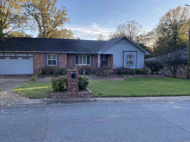 ranch-style house with brick siding, a shingled roof, a garage, driveway, and a front lawn