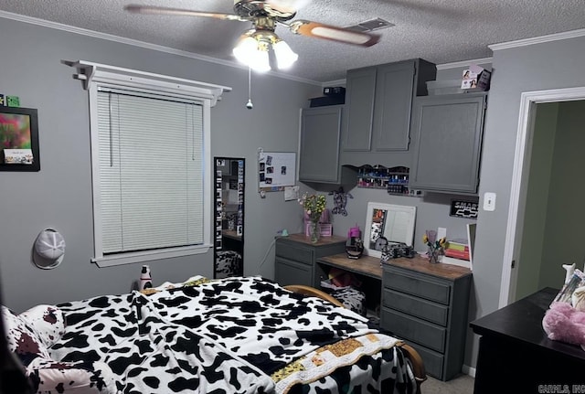 bedroom featuring a textured ceiling, ceiling fan, visible vents, and crown molding