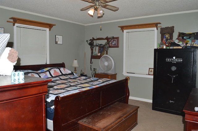 bedroom with baseboards, a ceiling fan, ornamental molding, a textured ceiling, and carpet floors