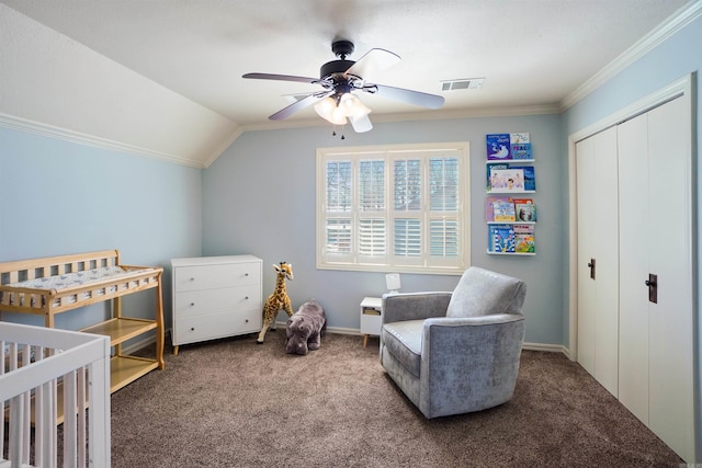 carpeted bedroom featuring visible vents, a ceiling fan, vaulted ceiling, crown molding, and a closet