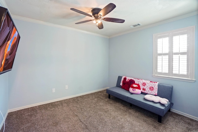 sitting room with carpet, visible vents, crown molding, and baseboards