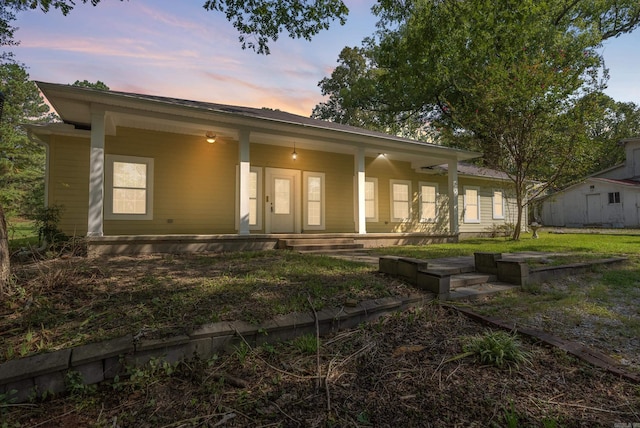 ranch-style house featuring covered porch