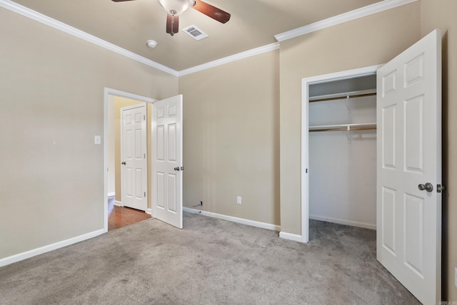 unfurnished bedroom featuring visible vents, crown molding, light carpet, and baseboards