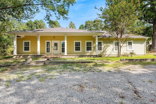 ranch-style home with covered porch