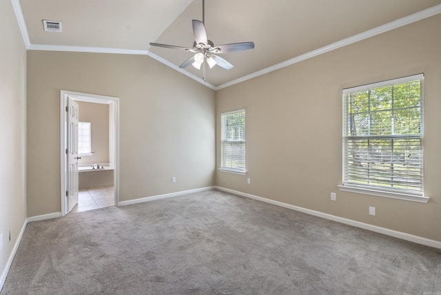 spare room with light carpet, visible vents, a ceiling fan, lofted ceiling, and ornamental molding