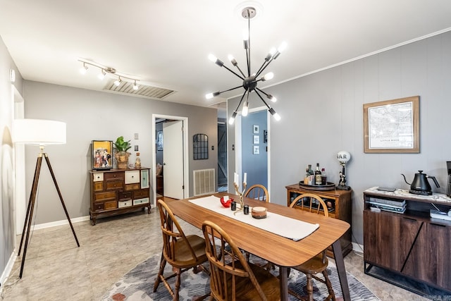 dining area with a chandelier, visible vents, and baseboards