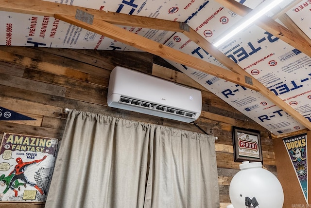 interior details featuring wood walls and a wall unit AC