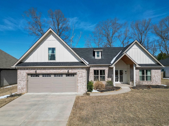 view of front of home with concrete driveway, brick siding, roof with shingles, and board and batten siding