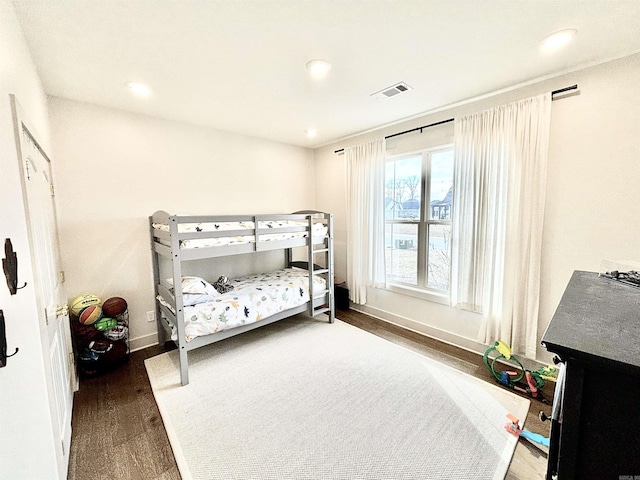 bedroom featuring recessed lighting, visible vents, dark wood finished floors, and baseboards