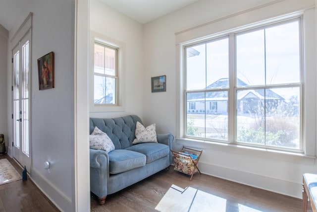 sitting room featuring dark wood finished floors and baseboards