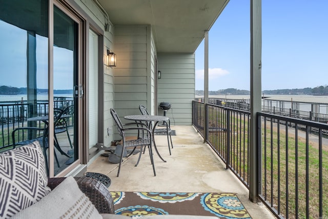 balcony featuring a water view