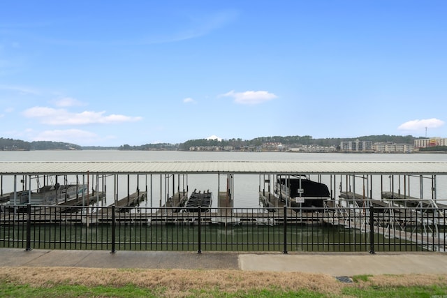 exterior space featuring a dock, a water view, and boat lift