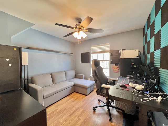 office area with light wood-style flooring and a ceiling fan