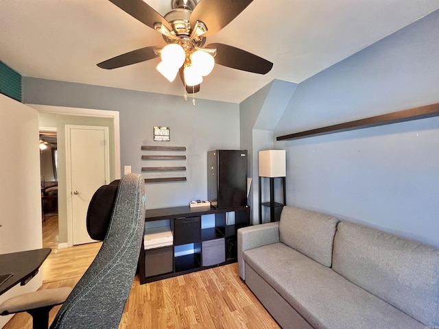 home office featuring light wood-type flooring and a ceiling fan