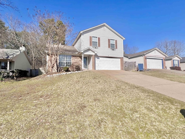 view of front of home featuring a garage, concrete driveway, and a front lawn