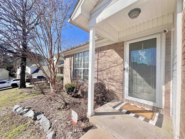 entrance to property with brick siding