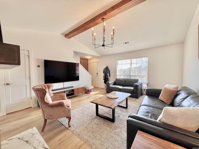 living area with vaulted ceiling with beams, light wood finished floors, visible vents, and a notable chandelier