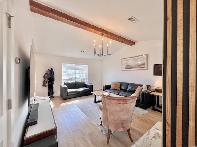 living area featuring lofted ceiling with beams, light wood-style floors, visible vents, and an inviting chandelier