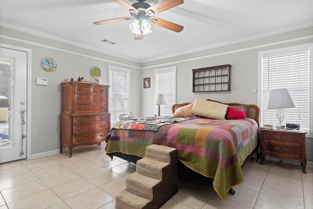 bedroom with crown molding, light tile patterned floors, visible vents, ceiling fan, and baseboards