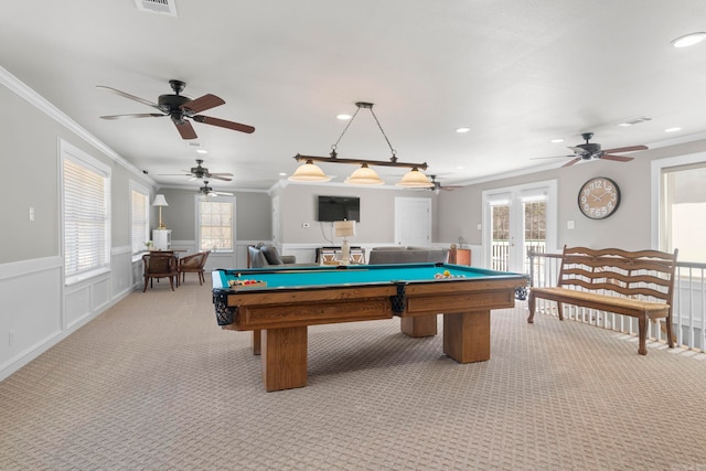 playroom featuring light carpet, a healthy amount of sunlight, and crown molding