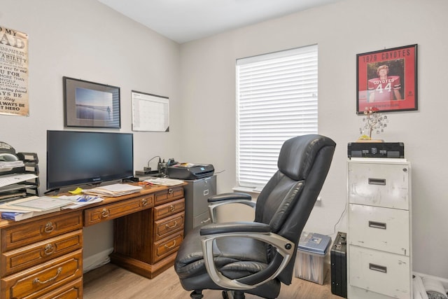 home office with light wood-type flooring