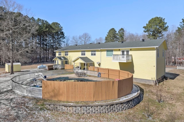 view of home's community with fence