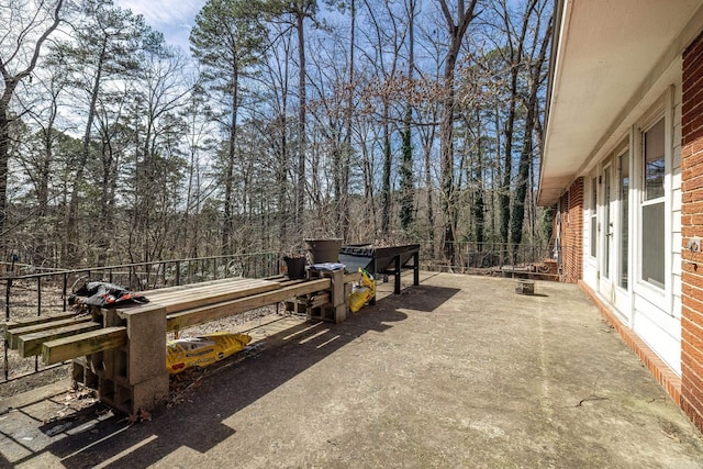 view of patio / terrace featuring fence