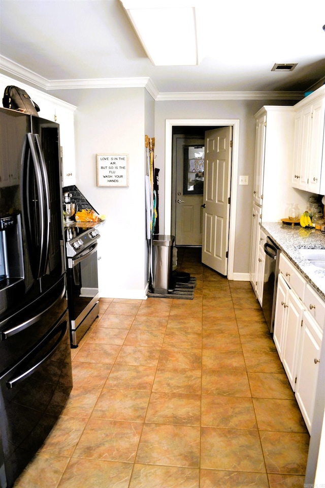 kitchen featuring visible vents, white cabinets, ornamental molding, appliances with stainless steel finishes, and light stone countertops