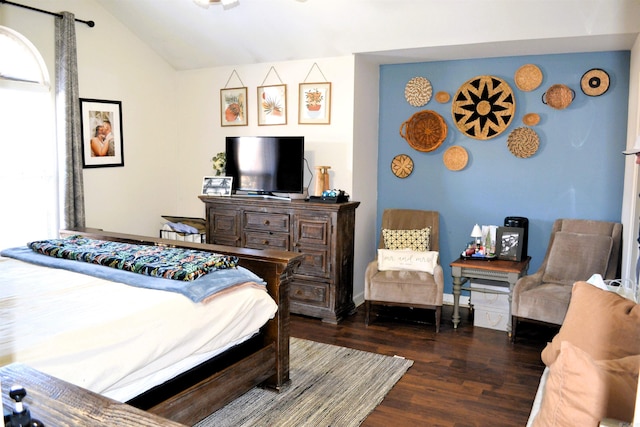 bedroom featuring vaulted ceiling, dark wood finished floors, and baseboards