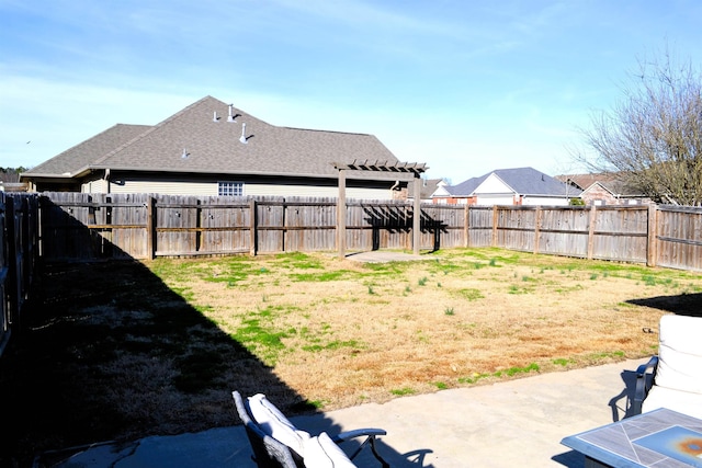 view of yard featuring a patio area and a fenced backyard