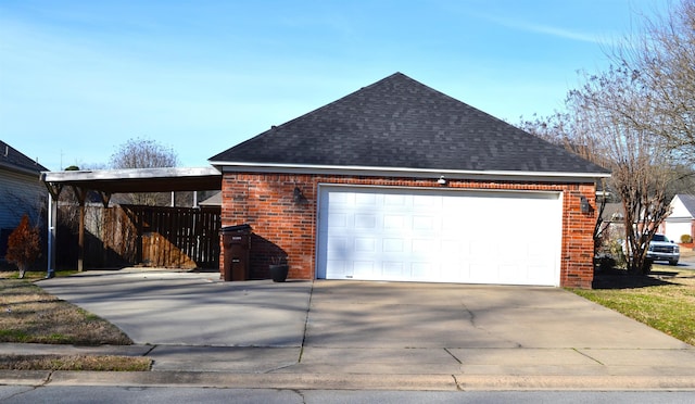 garage with concrete driveway