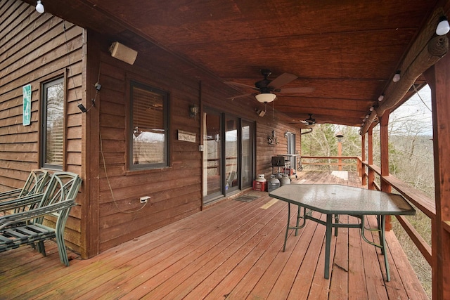 wooden terrace featuring ceiling fan