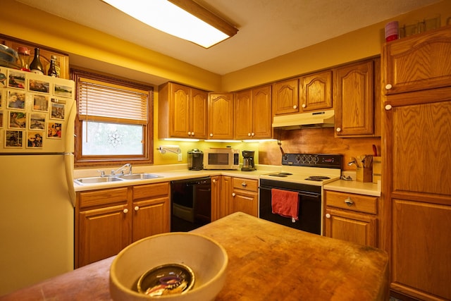 kitchen with under cabinet range hood, light countertops, dishwasher, and electric range