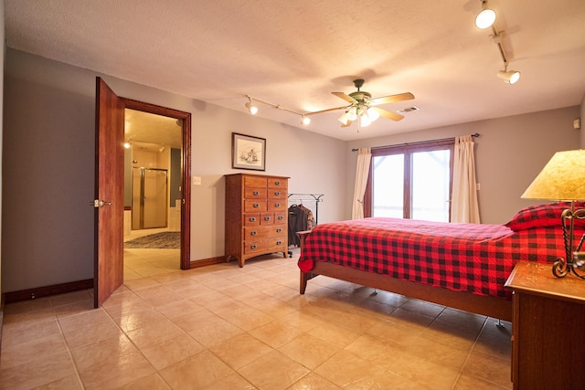 bedroom with visible vents, ceiling fan, a textured ceiling, and baseboards