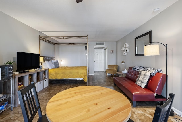 bedroom featuring visible vents and baseboards