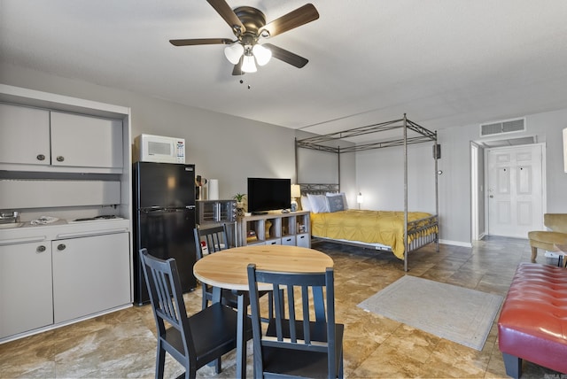 dining space with visible vents and a ceiling fan