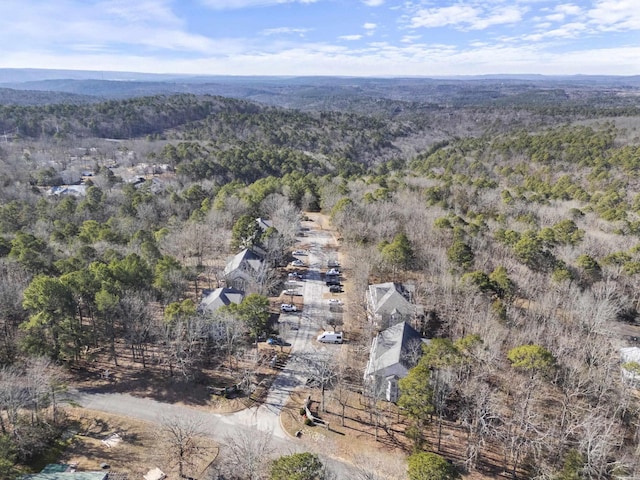 aerial view featuring a wooded view