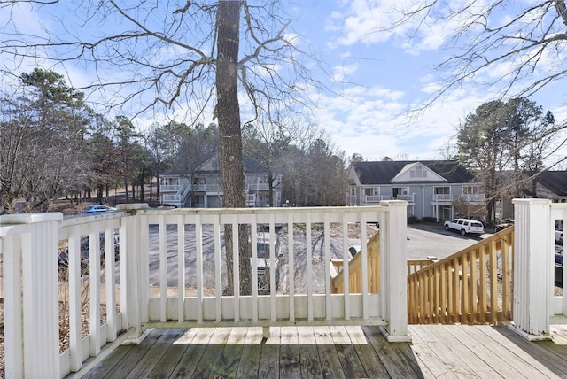 wooden deck featuring a residential view