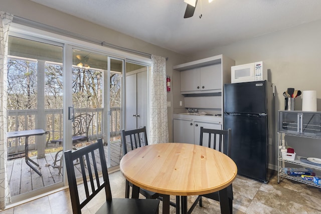 dining room featuring ceiling fan