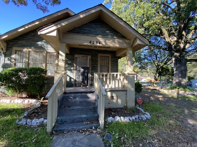 doorway to property featuring a porch